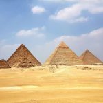 Giza Pyramids - brown pyramid under blue sky during daytime