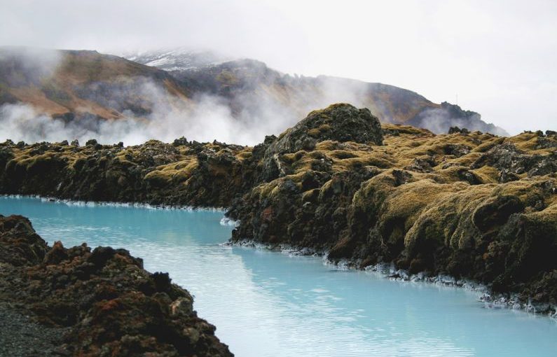 Blue Lagoon - landscape photography of river in the middle of mountains