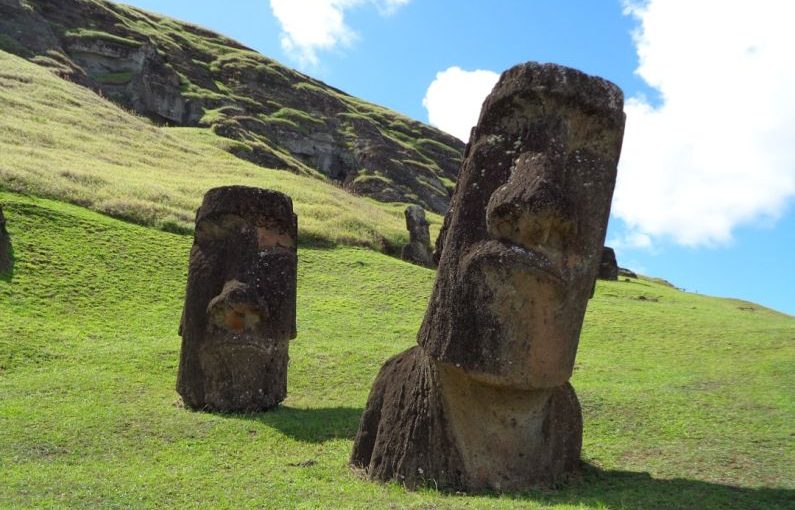 Easter Island - brown rock formation on green grass field during daytime