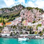 Amalfi Coast - white boat on body of water near green and brown mountain during daytime
